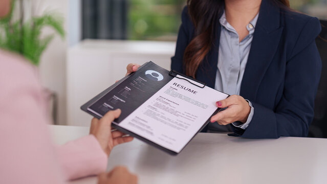 Two professionals reviewing a resume together